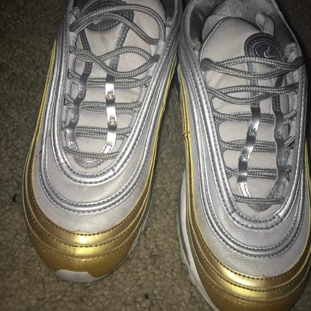 Gold and gray air max 97’s barley used